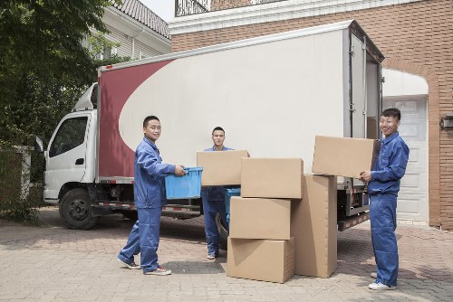Man and van loading furniture in Roehampton residential street