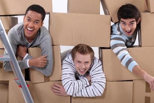 Loading boxes and furniture into a removal truck for Roehampton move