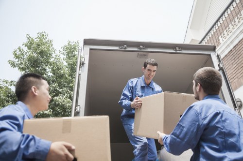 Packed office boxes and workstations ready for relocation in Roehampton