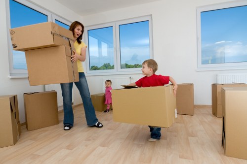 Packed household boxes ready for transport during Roehampton removals