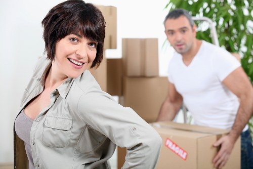 Professional movers checking property access and safety hazards
