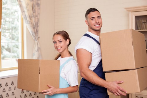 Team handling furniture and boxes during a Roehampton house move