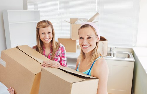 Local movers organising household items for packing in Roehampton